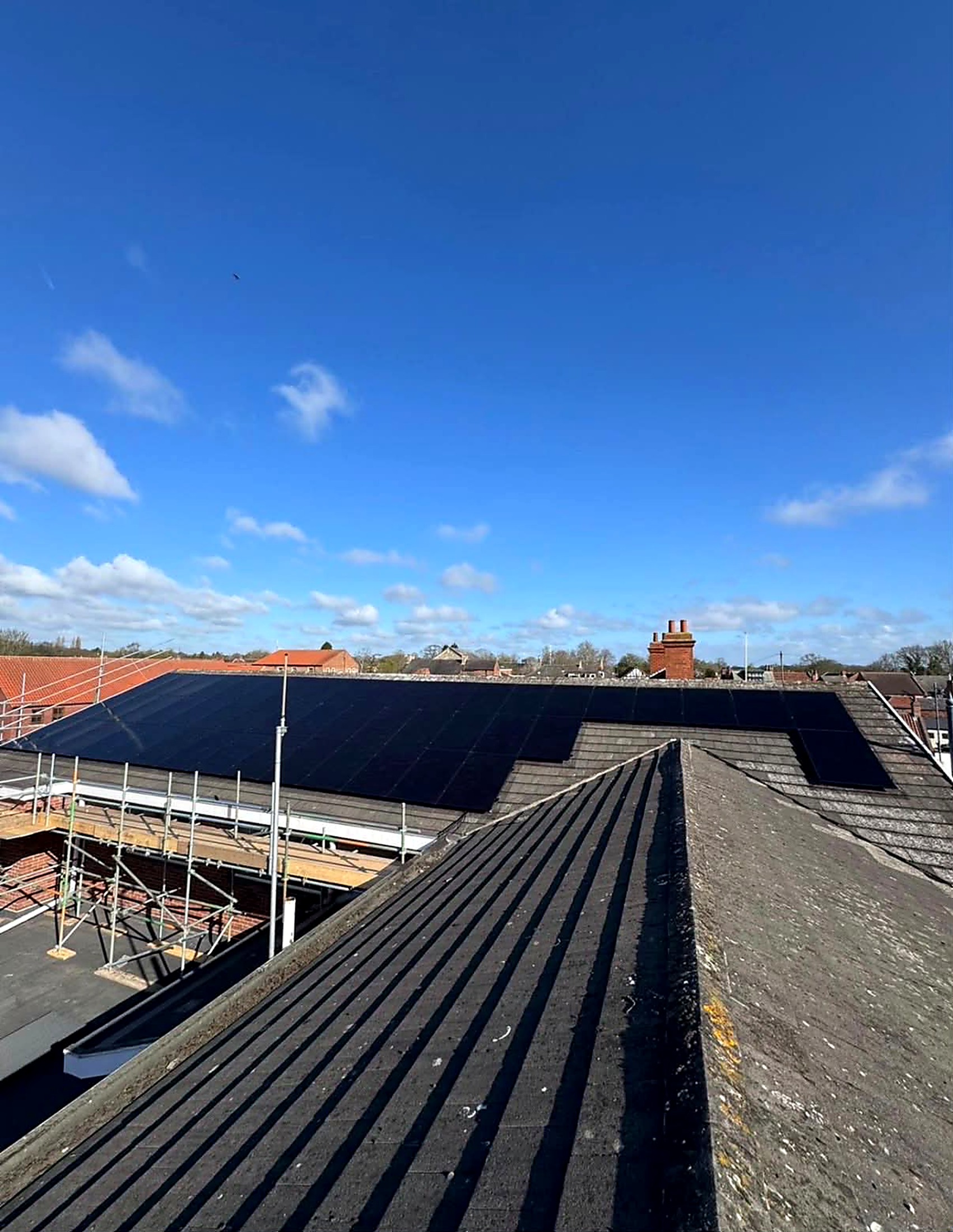 All-black solar panels on the pitched roof of Cottingham Civic Hall
