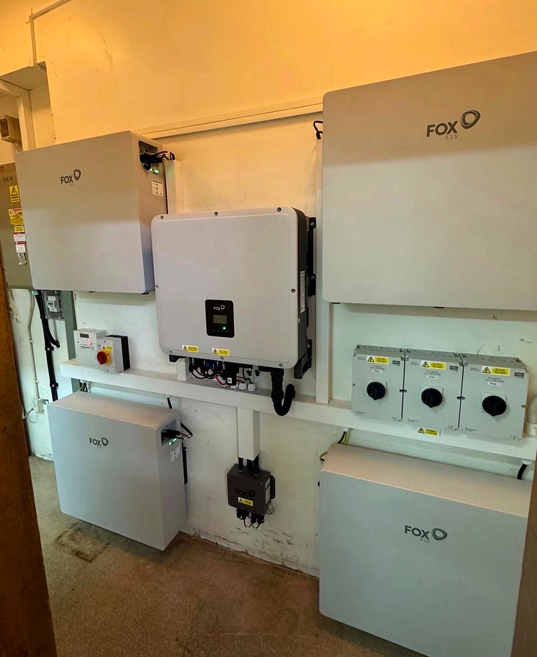 Fox ESS hybrid inverter and battery storage units with DC isolators inside Cottingham Civic Hall plant room